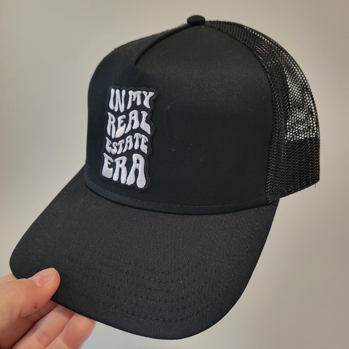 “In My Real Estate Era” Black Trucker Hat – 5 Panel Snapback