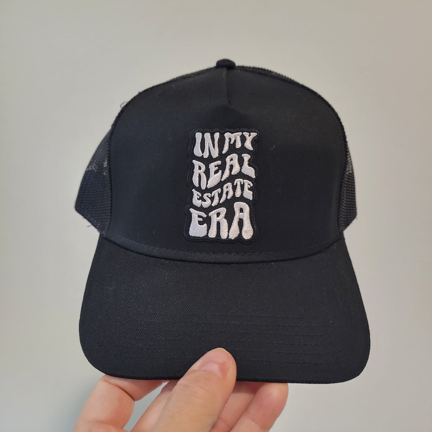 “In My Real Estate Era” Black Trucker Hat – 5 Panel Snapback