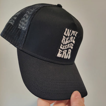 “In My Real Estate Era” Black Trucker Hat – 5 Panel Snapback